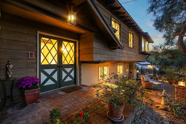exterior entry at dusk with fence