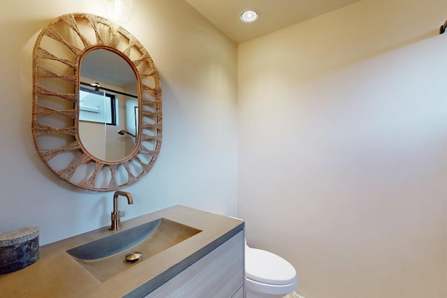 670 Santa Lucia Ave, Los Osos, CA 93402 - half bathroom with toilet, vanity, and recessed lighting