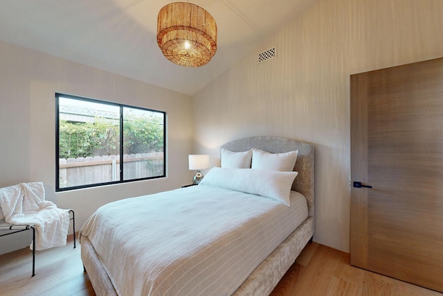 670 Santa Lucia Ave, Los Osos, CA 93402 - bedroom featuring light wood-type flooring, visible vents, and vaulted ceiling