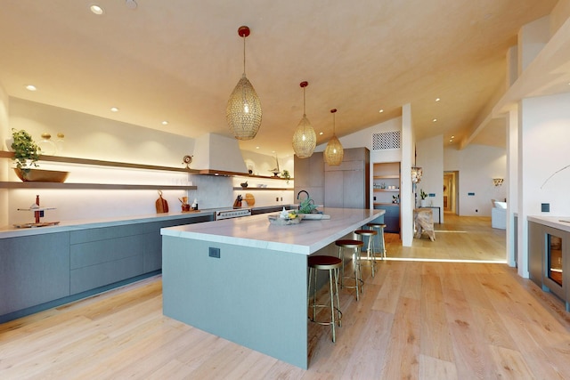 670 Santa Lucia Ave, Los Osos, CA 93402 - kitchen featuring a spacious island, range hood, open shelves, modern cabinets, and pendant lighting
