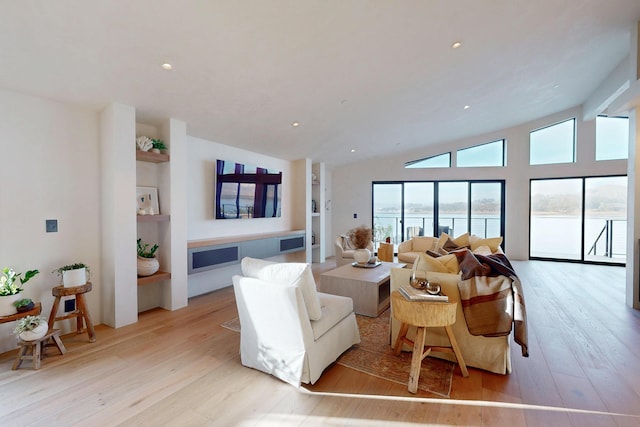 670 Santa Lucia Ave, Los Osos, CA 93402 - living area with light wood-style floors, lofted ceiling, a water view, and recessed lighting