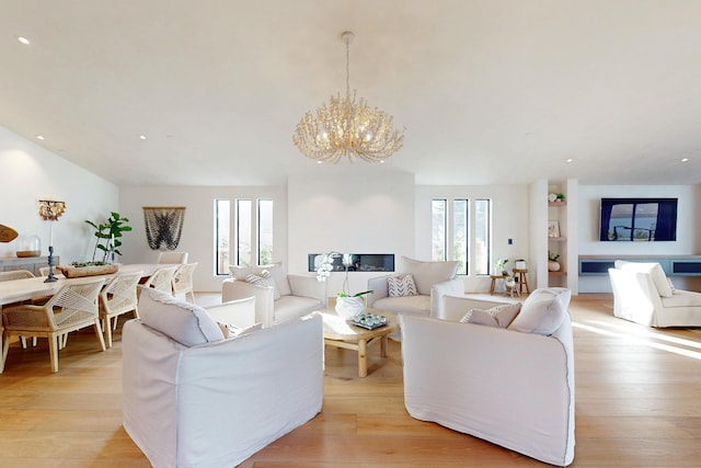 670 Santa Lucia Ave, Los Osos, CA 93402 - living area featuring light wood finished floors, recessed lighting, and a notable chandelier