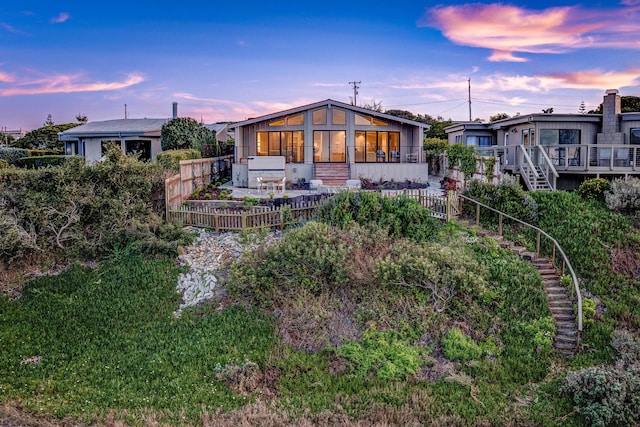 670 Santa Lucia Ave, Los Osos, CA 93402 - back of house at dusk with a fenced backyard