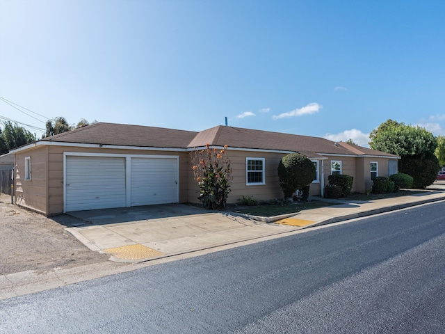 single story home featuring a garage