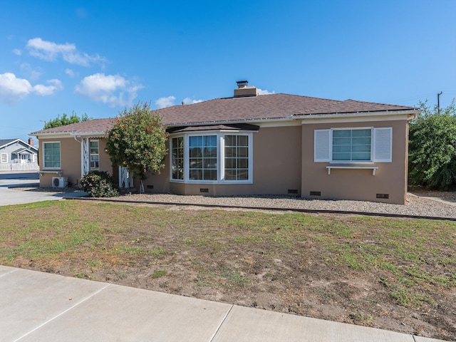 single story home with a front yard