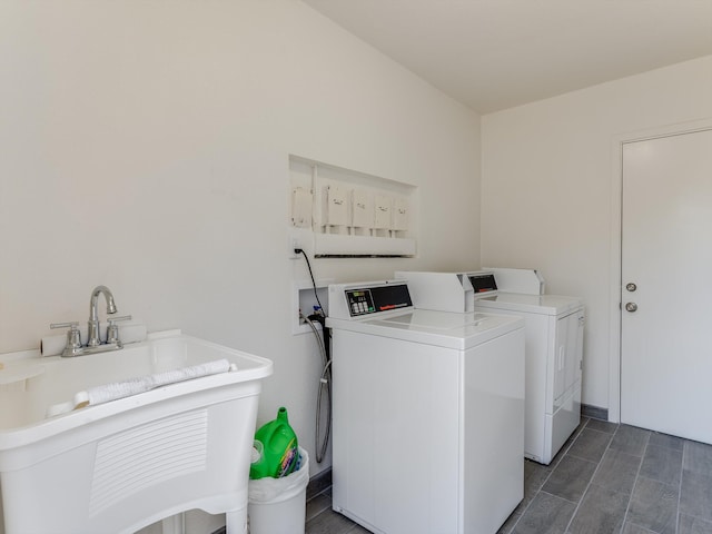 laundry room with sink and separate washer and dryer