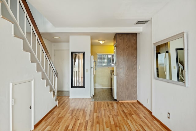 entryway with light hardwood / wood-style flooring