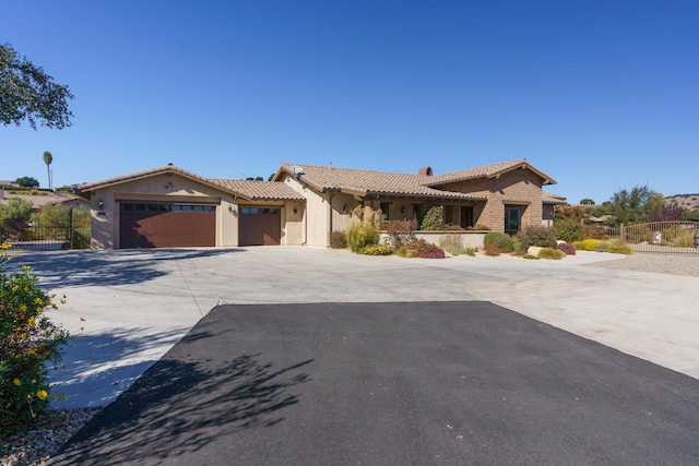 mediterranean / spanish-style home featuring a garage