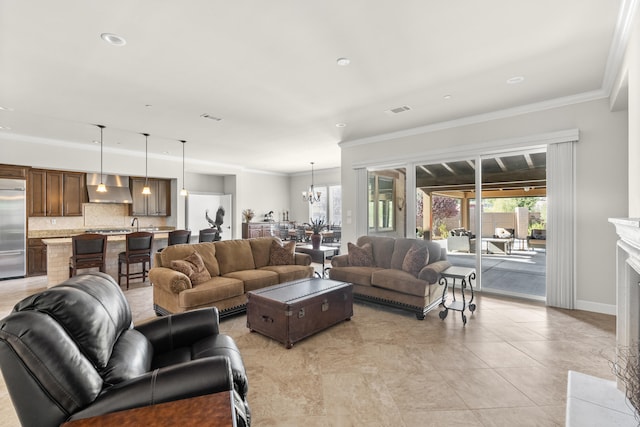 tiled living room featuring ornamental molding, an inviting chandelier, and a high end fireplace