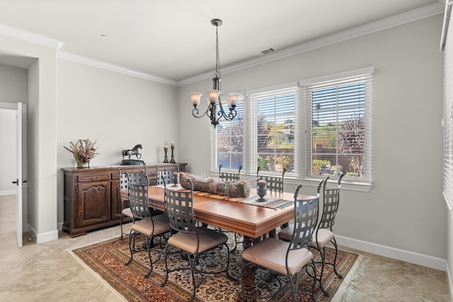 dining area featuring crown molding and a chandelier