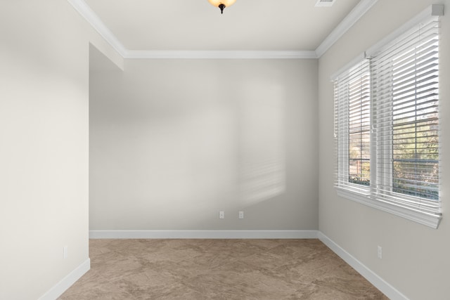 spare room featuring crown molding