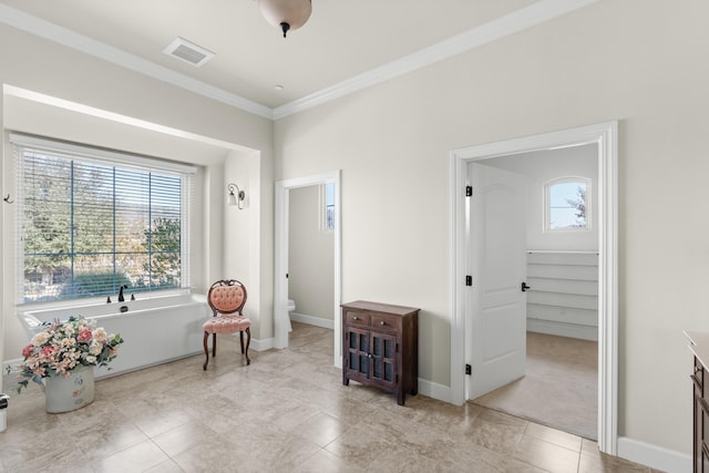 living area featuring ornamental molding