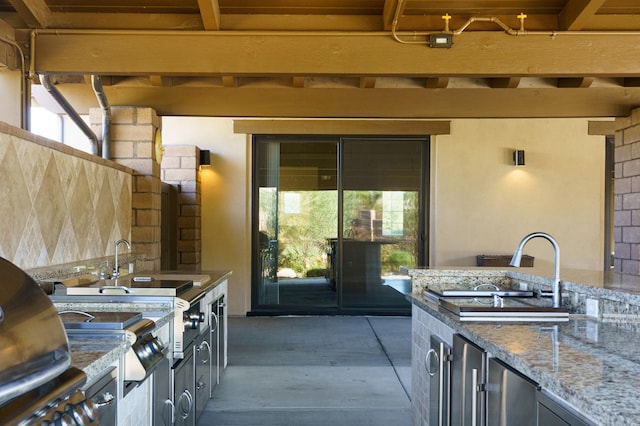 view of patio / terrace featuring an outdoor kitchen and wine cooler