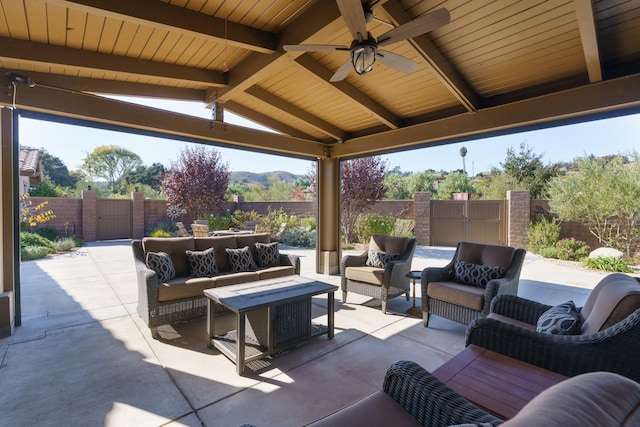 view of patio / terrace with an outdoor hangout area, ceiling fan, a mountain view, and a gazebo