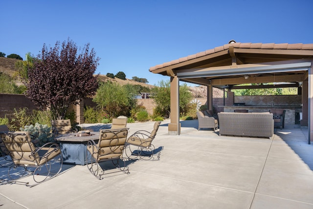 view of patio / terrace with a gazebo and an outdoor living space with a fire pit