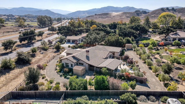 birds eye view of property with a mountain view