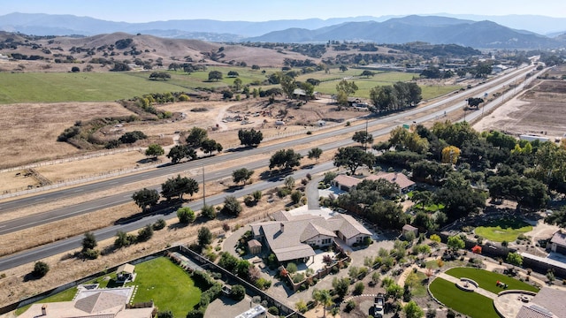 birds eye view of property with a mountain view