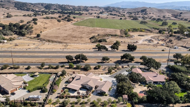 bird's eye view with a rural view and a mountain view