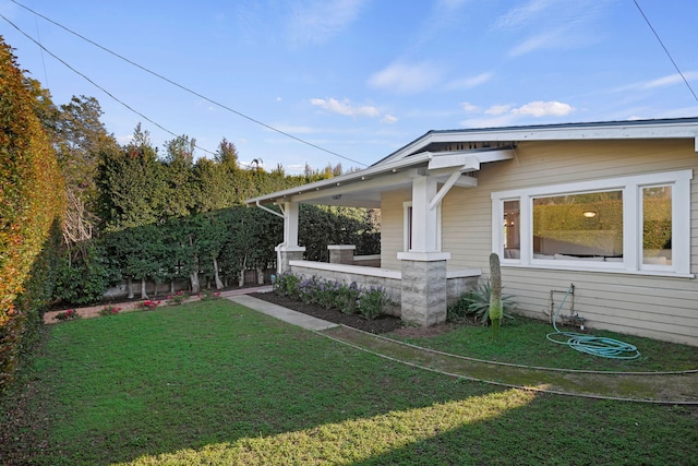 exterior space with a front lawn and fence