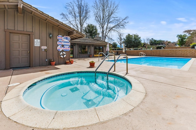 community pool featuring a patio area