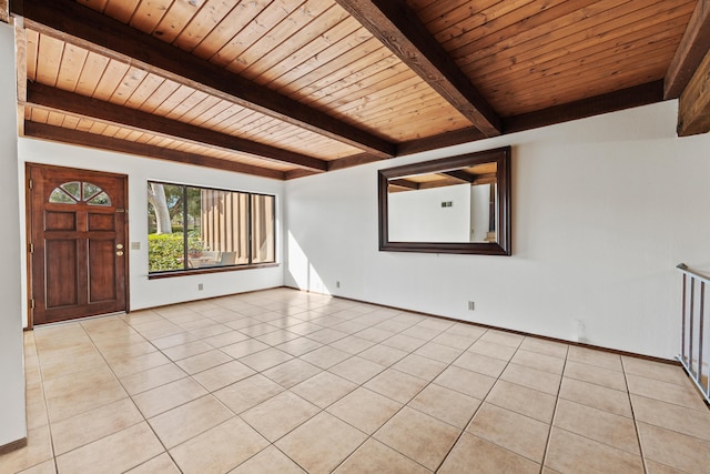 unfurnished room featuring wood ceiling, baseboards, beamed ceiling, and light tile patterned flooring