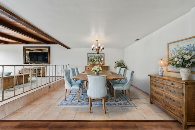 dining space featuring beam ceiling, light tile patterned flooring, a notable chandelier, and visible vents