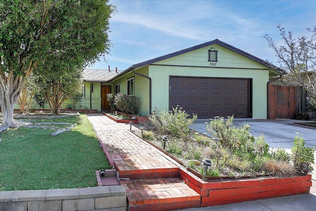 single story home with stucco siding, concrete driveway, fence, a garage, and a front lawn