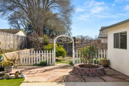 view of patio featuring fence