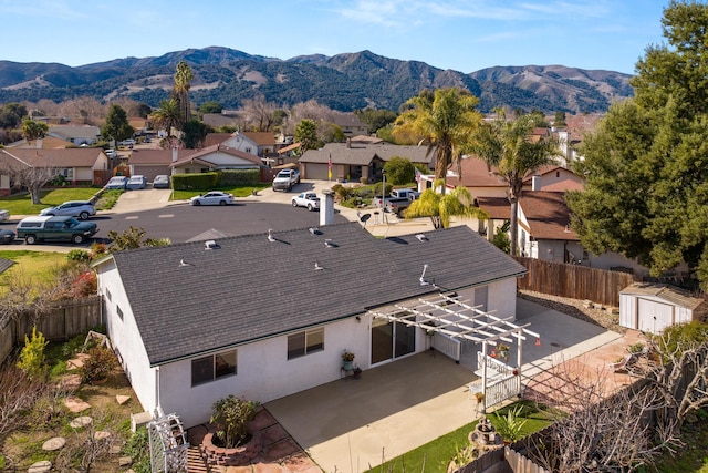 drone / aerial view featuring a mountain view and a residential view