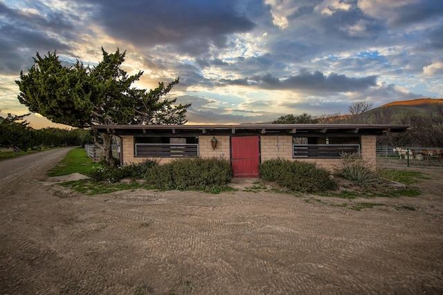 view of front of home with concrete block siding