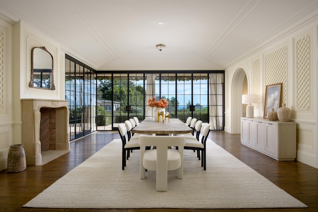 771 Garden Ln, Montecito, CA 93108 - dining area featuring crown molding, dark wood finished floors, a healthy amount of sunlight, and a decorative wall