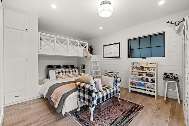 bedroom featuring light wood finished floors and recessed lighting