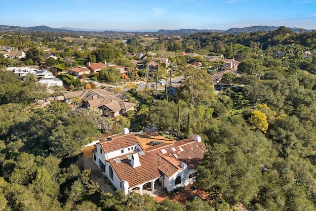 drone / aerial view featuring a view of trees