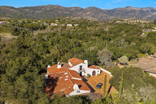 birds eye view of property with a mountain view