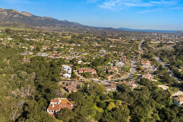 drone / aerial view featuring a residential view and a mountain view