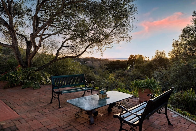 view of patio terrace at dusk