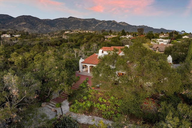 aerial view at dusk with a mountain view