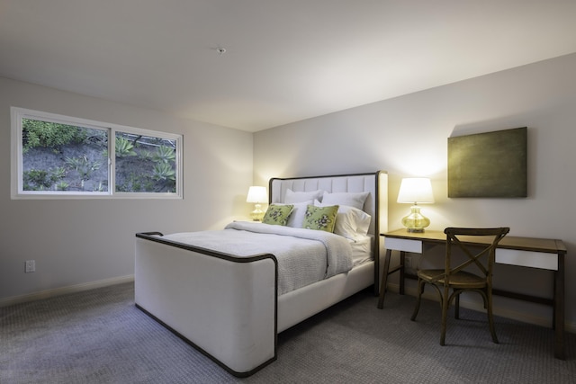 bedroom with carpet and baseboards