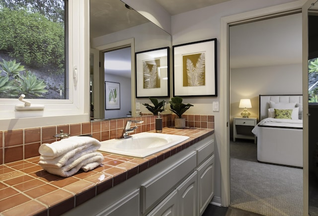 bathroom featuring vanity and decorative backsplash