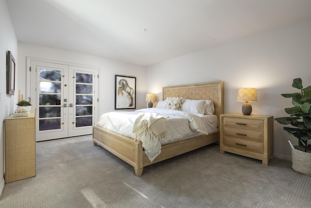 bedroom featuring dark colored carpet, french doors, and access to outside