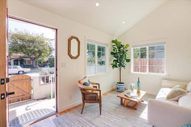 sitting room featuring vaulted ceiling, baseboards, wood finished floors, and recessed lighting