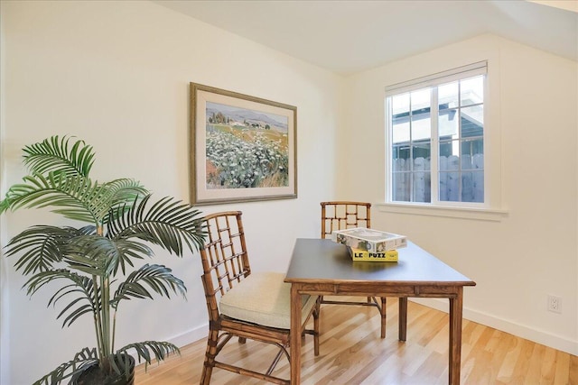 office space featuring light wood-type flooring and baseboards