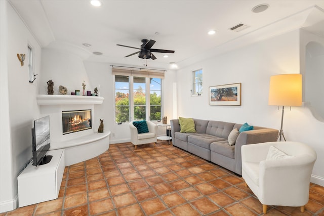 living area featuring a fireplace, recessed lighting, visible vents, ceiling fan, and baseboards