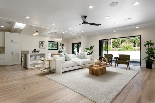 living room featuring recessed lighting, light wood-type flooring, and a ceiling fan