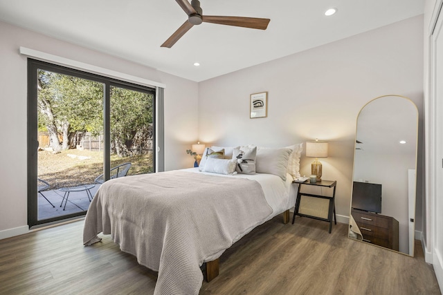 bedroom featuring access to outside, baseboards, wood finished floors, and recessed lighting