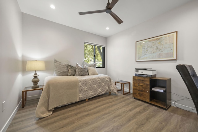 bedroom featuring ceiling fan, baseboards, wood finished floors, and recessed lighting