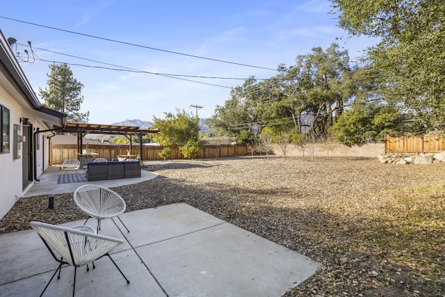 view of yard with a fenced backyard, a patio, and a pergola