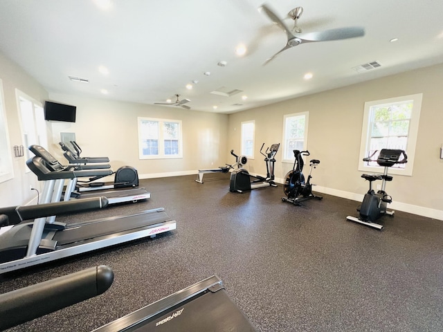 workout area featuring a ceiling fan, baseboards, and visible vents