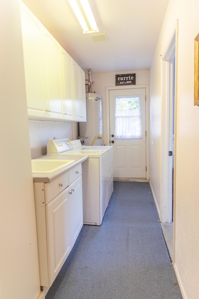 laundry room featuring light carpet, cabinet space, baseboards, washer and clothes dryer, and secured water heater