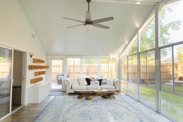 sunroom featuring ceiling fan and vaulted ceiling